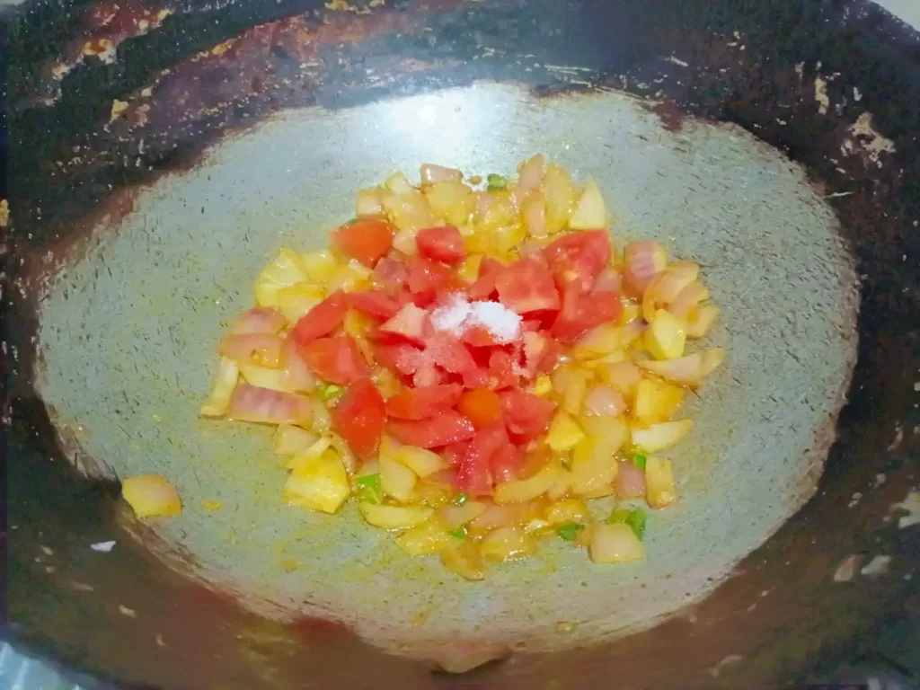 add 1 medium-sized chopped tomato and salt as per taste