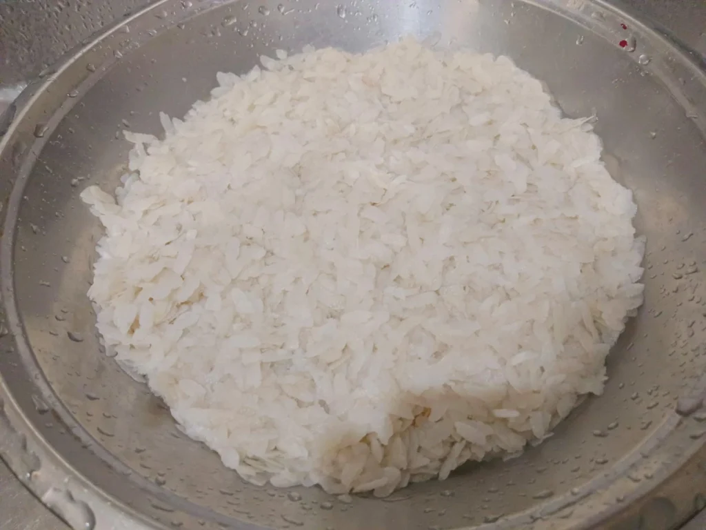 Wash 2.5 cups of poha in water for a min and strain out excess water, ensuring not to soak in water for long as poha will become too mushy.