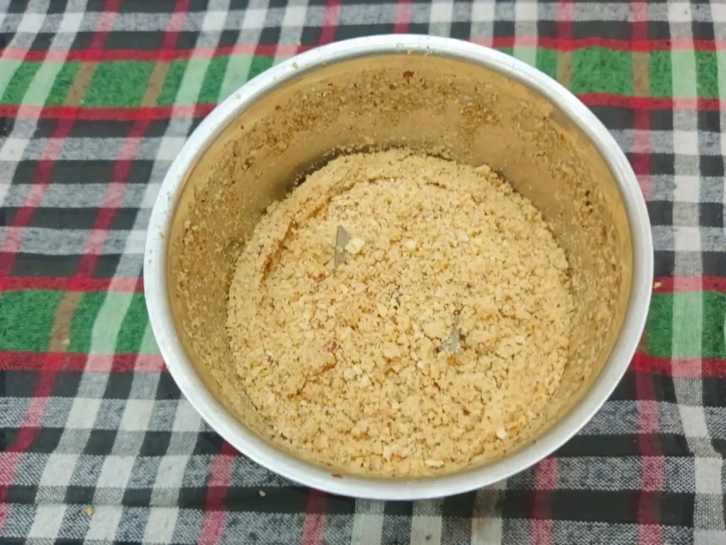 2. Once the mixture has cooled completely, transfer it to a mixer grinder and grind it into a fine powder.