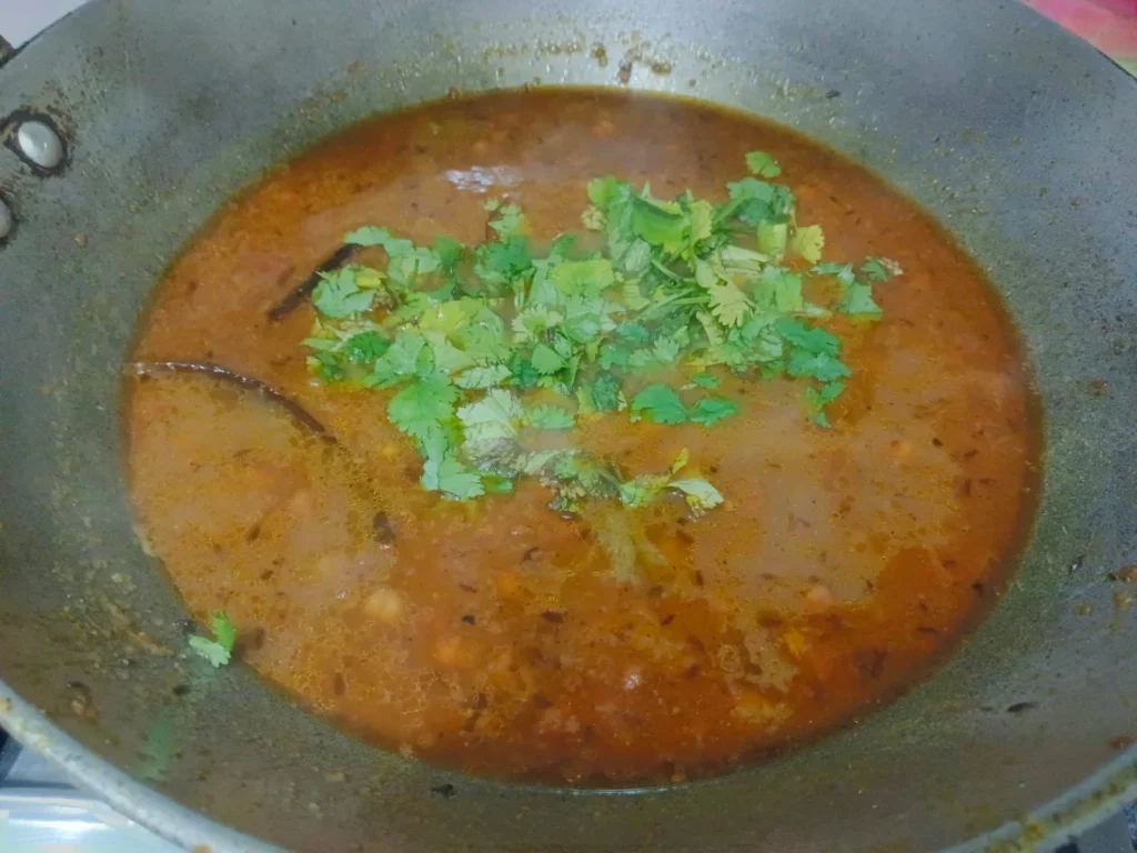 At last, add garam masala and coriander leaves for more flavor in the curry.