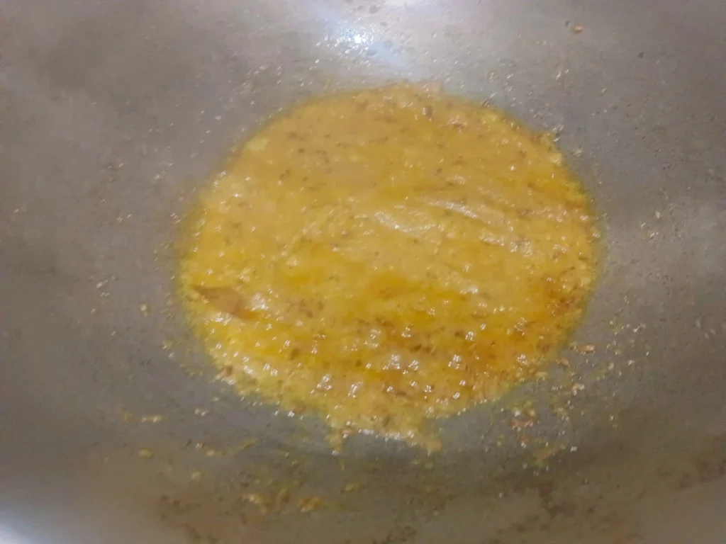 Now add the onion paste and coriander powder and sauté the mixture until the masala becomes golden and fragrant.