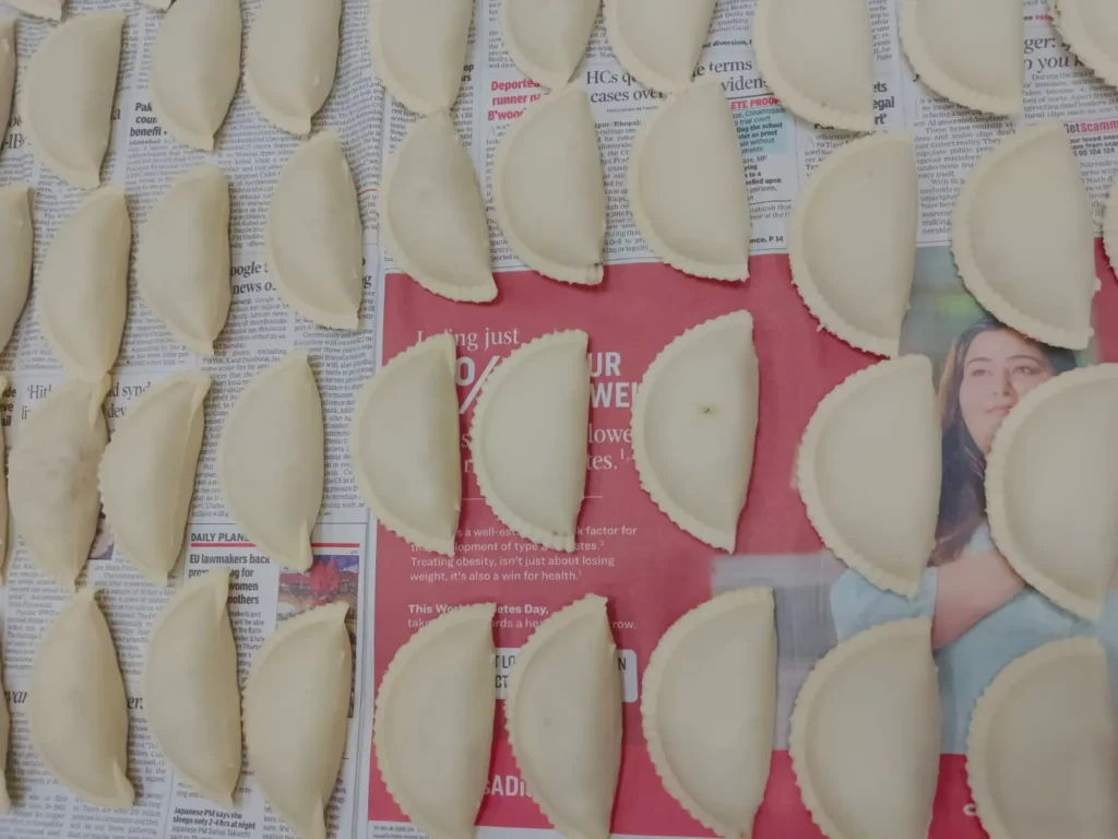 3. You can use a gujiya maker to help shape and seal them properly.